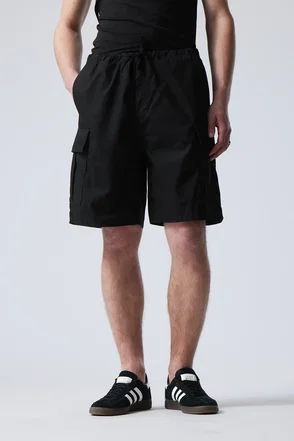 Black WEEKDAY cargo shorts with drawstring waist.