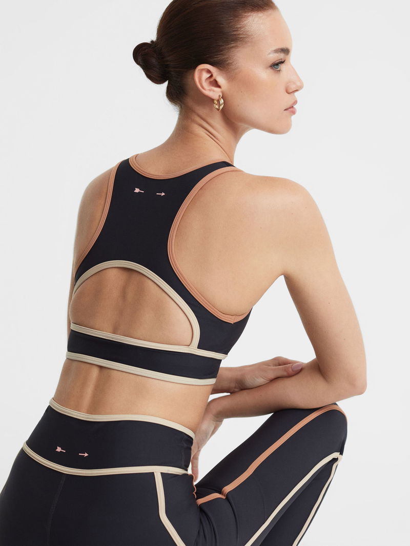 THE UPSIDE Northstar Nora Racerback Cut-Out Sports Bra in Black