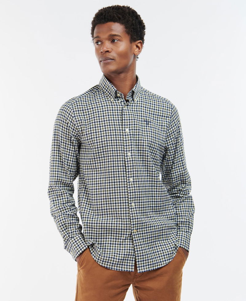 Man wearing a blue and white gingham Barbour shirt