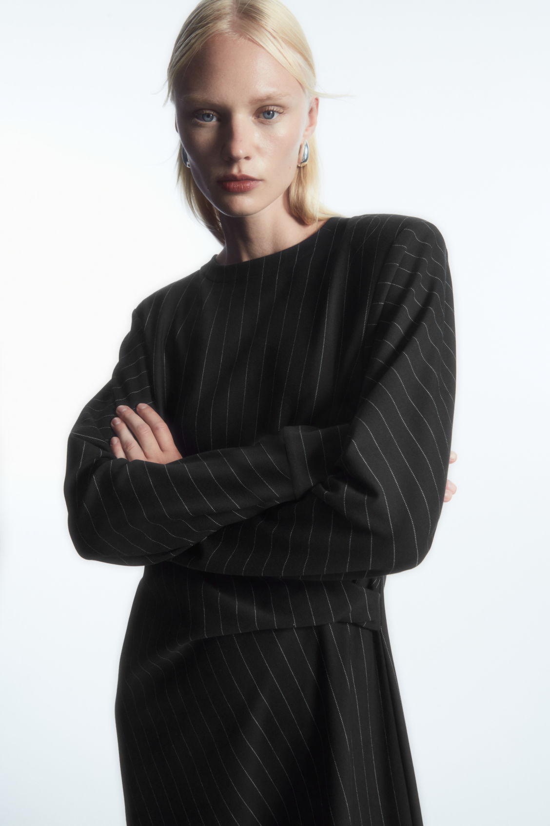 cos power shoulder midi dress Autumn Winter 24 Formality and irreverence in the power-shoulder midi dress