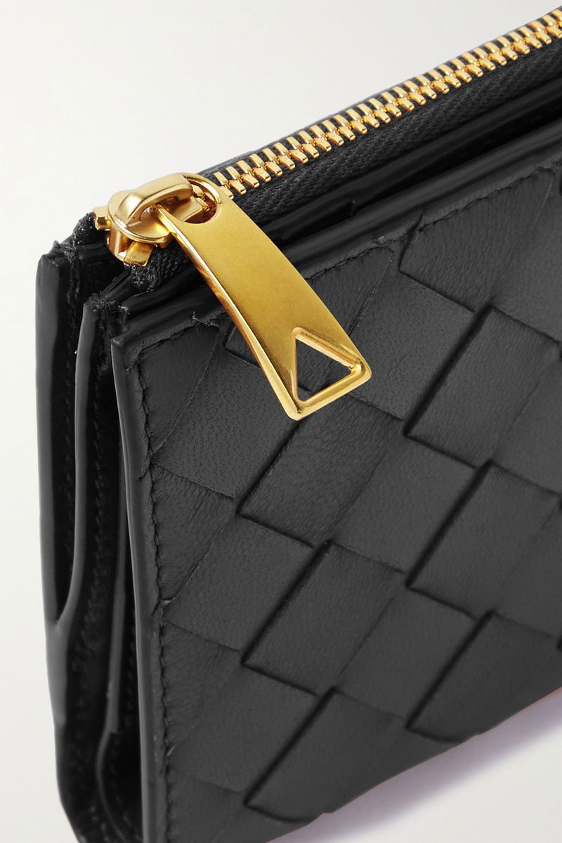 Black woven leather wallet with gold zipper detail