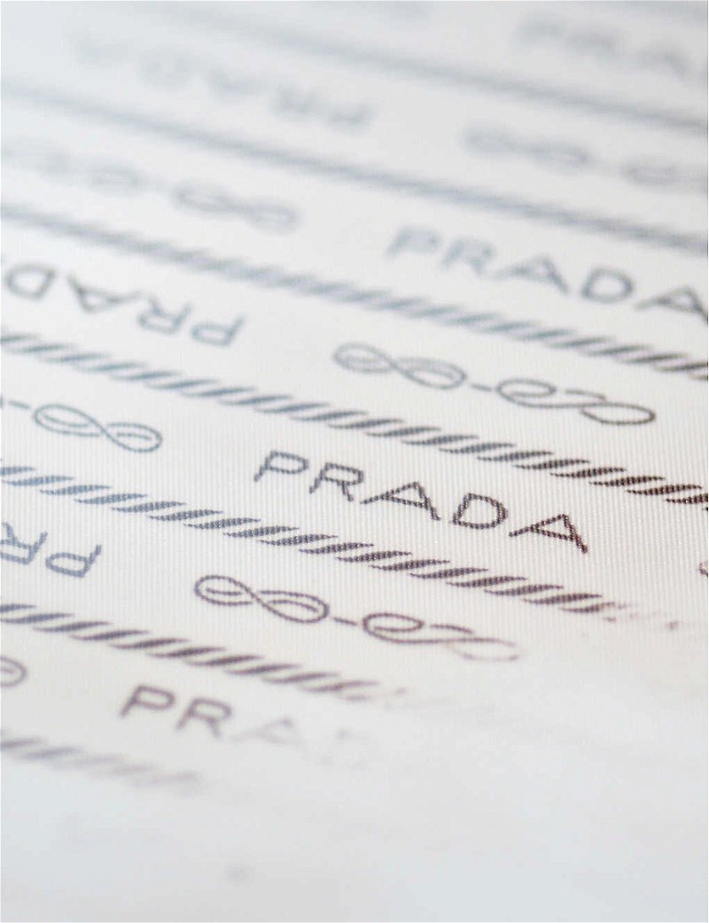PRADA Heat-reactive logo-plaque recycled-polyamide puffer jacket