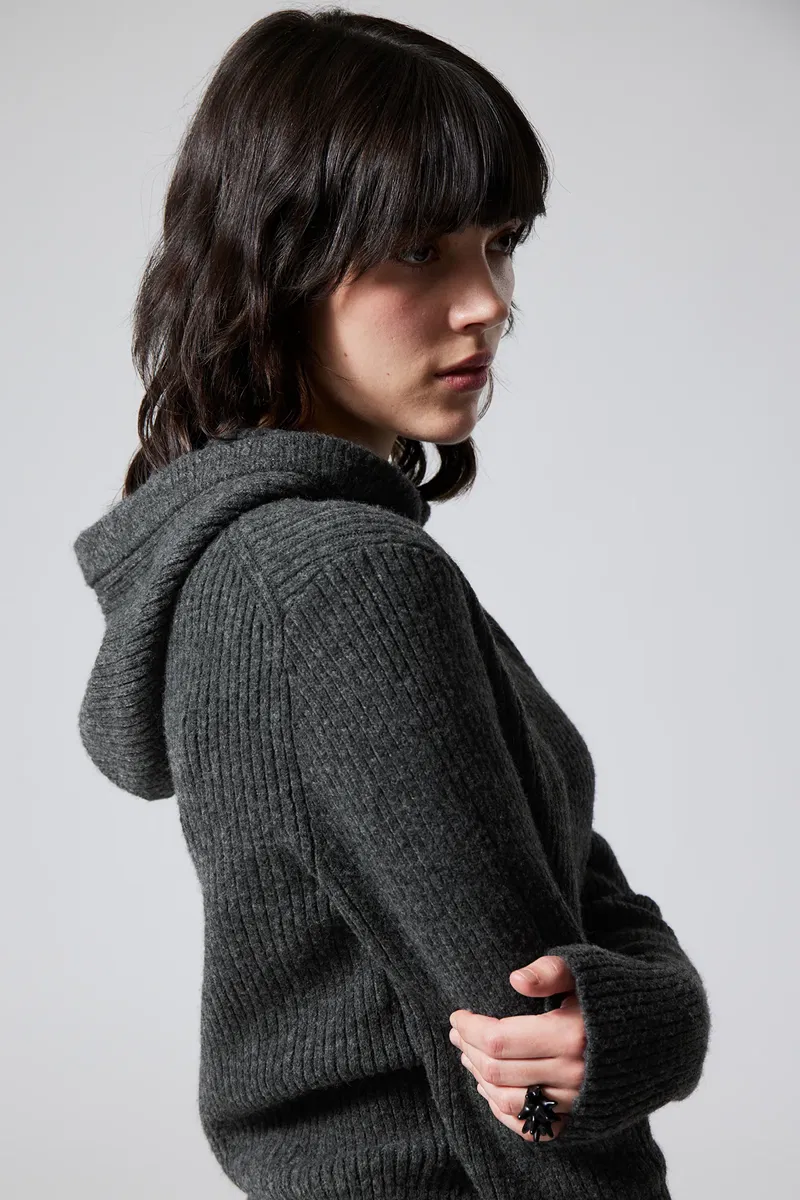 Gray ribbed turtleneck sweater with a model wearing it.