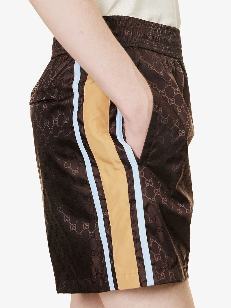 Gucci Monogram Print Mid Rise Swim Shorts In Chocolate Mc Endource