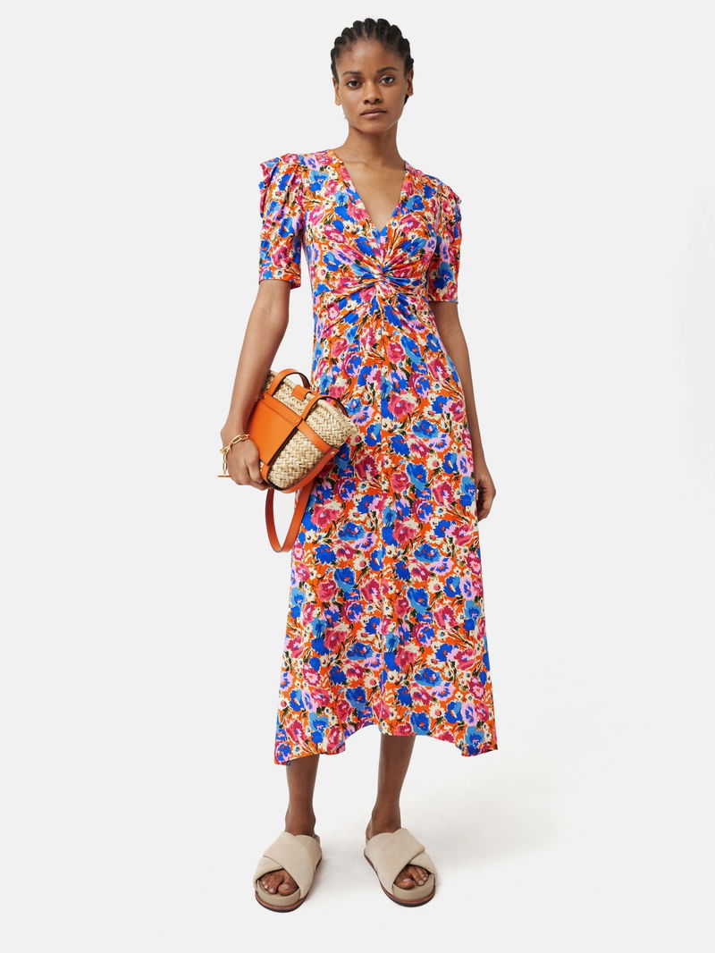 wild meadow print ruched midi dress Me + Em Wild Meadow Print Ruched Midi Dress worn by Natalie Morales as seen in CBS Mornings on April 7, 2023