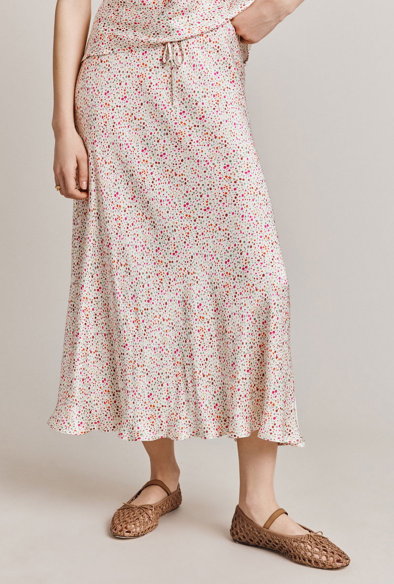 Floral print silk midi skirt with drawstring waist and woven shoes.