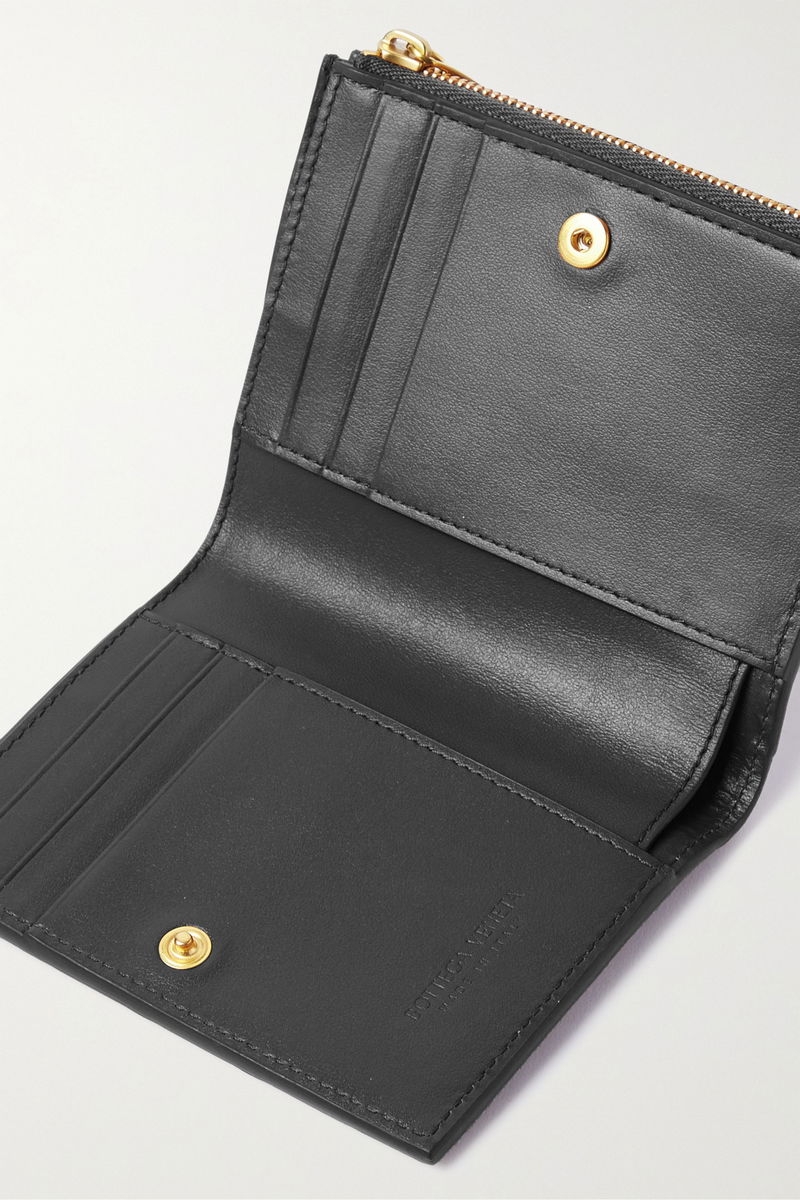 Dark green leather wallet with gold zipper detail