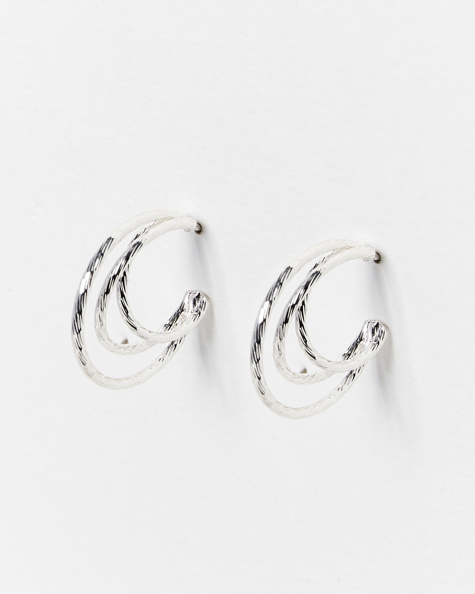 Oliver Bonas Twisted Metal Triple Hoop Earrings In Silver Endource 9072