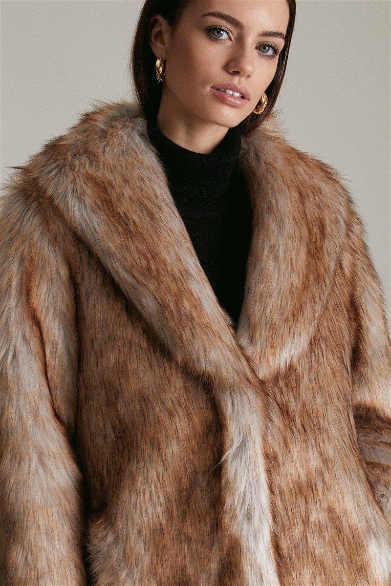 Karen Millen - Exuding easy glamour, this plush faux fur coat will be the  star of your cover-up collection. Its soft, snug texture, handy pockets and  large lapels make it a wearable