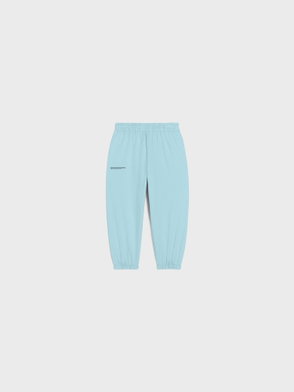 Light blue PANGAIA fleece joggers with ribbed cuffs.