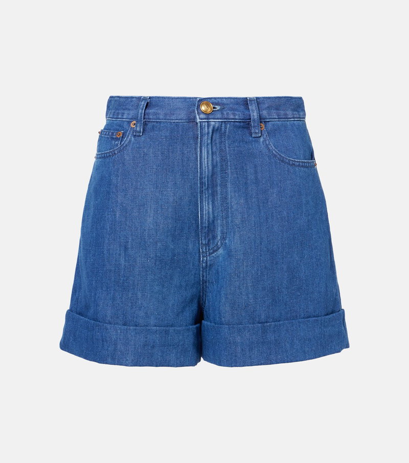 Blue denim shorts with rolled-up cuffs
