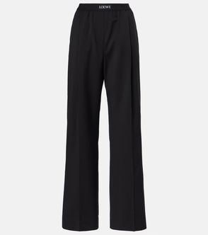 Black wide-leg trousers with a grosgrain ribbon waistband.