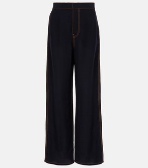Dark navy trousers with golden stitching