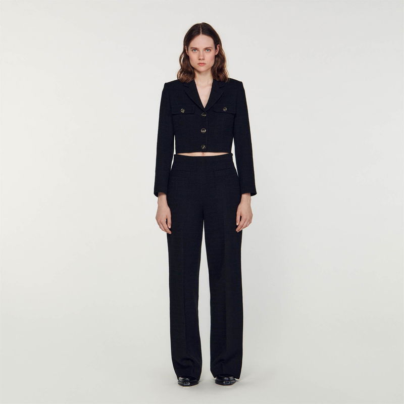 Black tweed blazer and wide-leg trousers set.