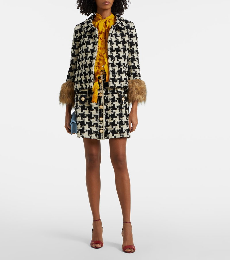 Valentino houndstooth tweed jacket with faux fur cuffs and a yellow silk scarf.