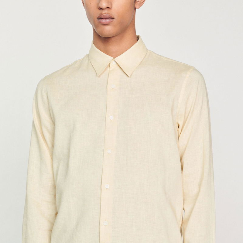 Sandro - Light yellow linen shirt on a man.