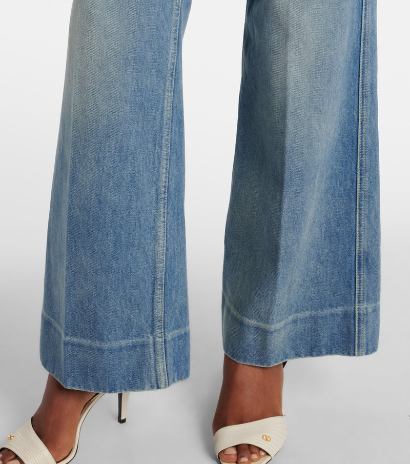 Valentino wide-leg denim jeans with gold detailing and heels
