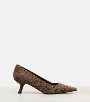 Brown velvet pump with a delicate patterned heel.
