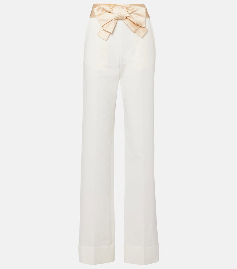 Cream wide-leg trousers with a satin bow belt