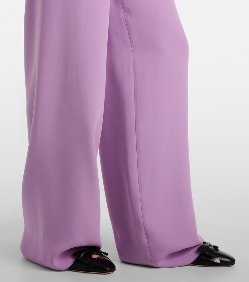 Valentino wide-leg trousers in lavender satin with bow details.