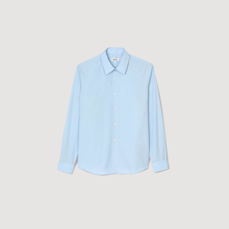 Light blue SANDRO long-sleeved shirt, buttoned.