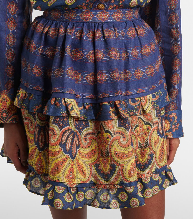 Blue denim mini dress with paisley print and tiered ruffle detail