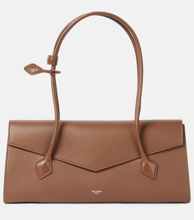 Brown leather shoulder bag with a looped handle.