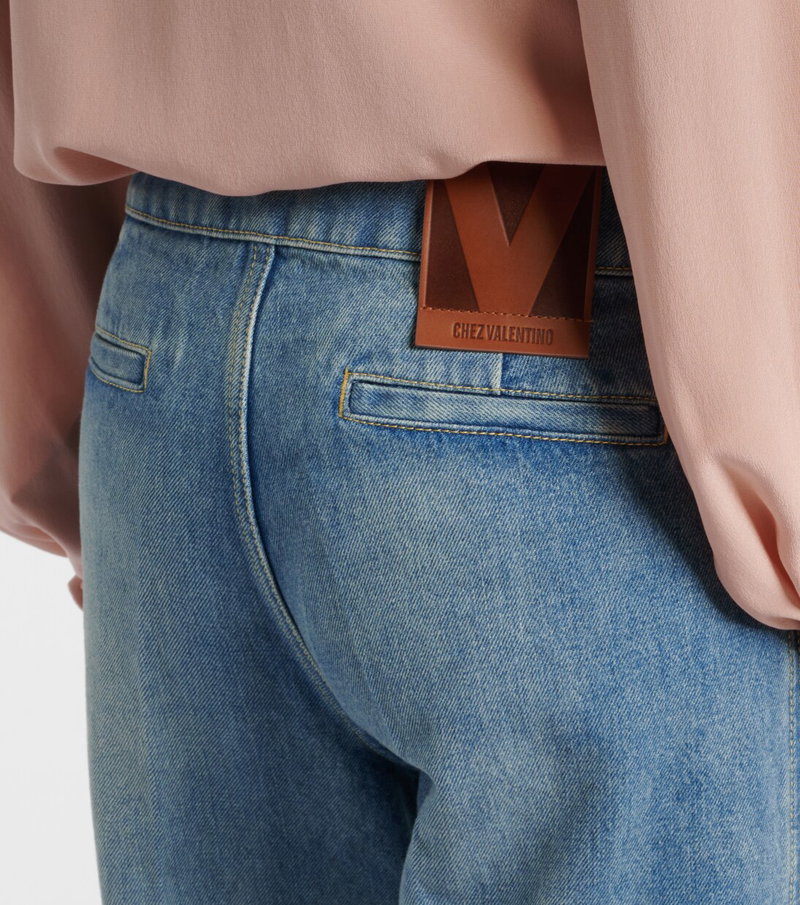 Valentino denim pants with brown leather logo tab