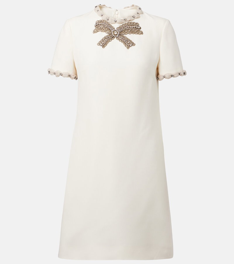 Cream-colored dress with embellished bow neckline