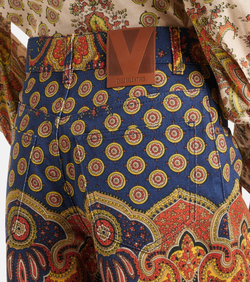 Valentino paisley trousers with a brown leather tag.
