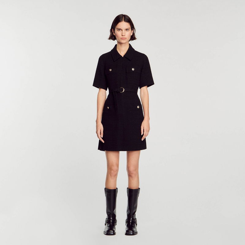 Black tweed dress with belted waist and button details.