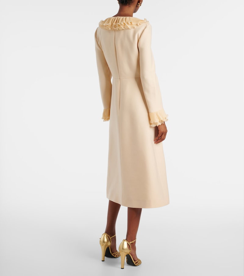 Cream-colored Valentino dress with ruffled sleeves.