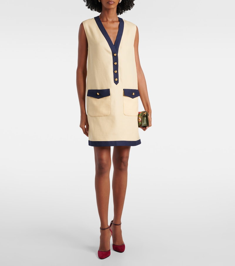 Valentino beige sleeveless dress with navy trim and gold buttons.
