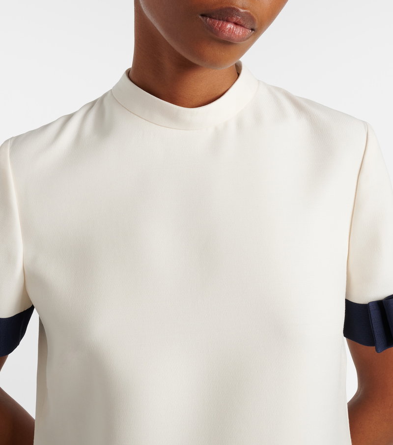 Valentino cream blouse with navy ribbon cuffs