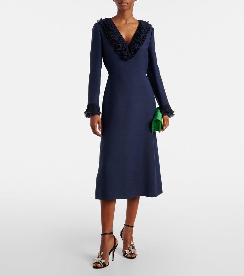 Dark blue Valentino dress with ruffled neckline and matching clutch.