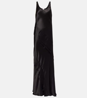 Black silk slip dress, draped and angled.