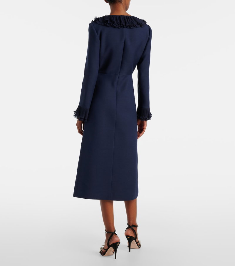Dark blue velvet gown with lace cuffs