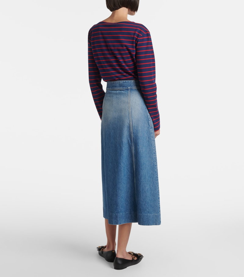Valentino denim skirt with a striped long-sleeve top and embellished shoes