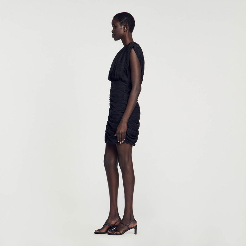 Black draped mini dress, side view