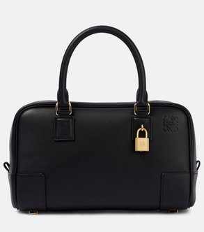 Black leather tote bag with gold hardware