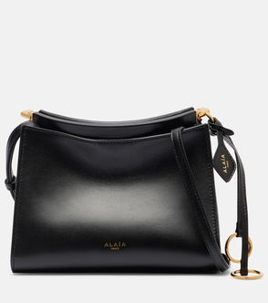 Black leather shoulder bag with gold hardware