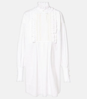 White Valentino blouse with ruffled detailing and bishop sleeves.