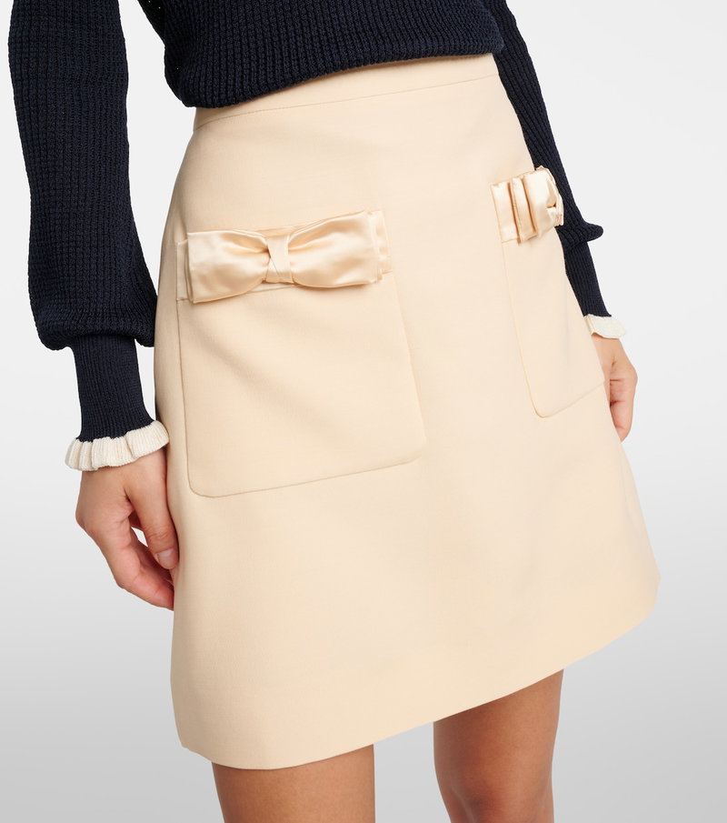 Peach satin-bowed skirt with pockets, Valentino