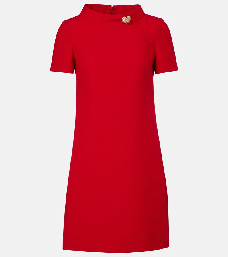 Red crepe dress with a gold heart embellishment