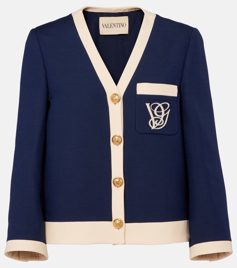 Navy and cream blazer with gold buttons and a monogram pocket