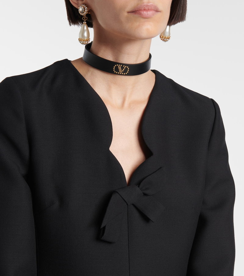 Valentino black velvet blouse with a bow detail and pearl choker.