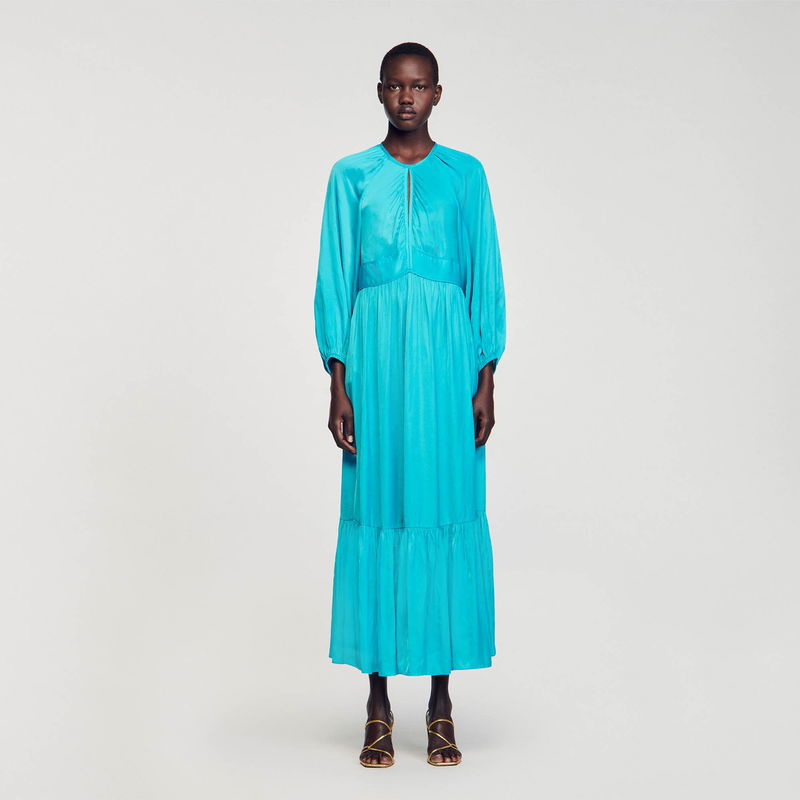 Satin turquoise maxi dress with puffed sleeves.