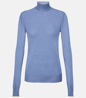 Blue merino wool turtleneck on a light grey background