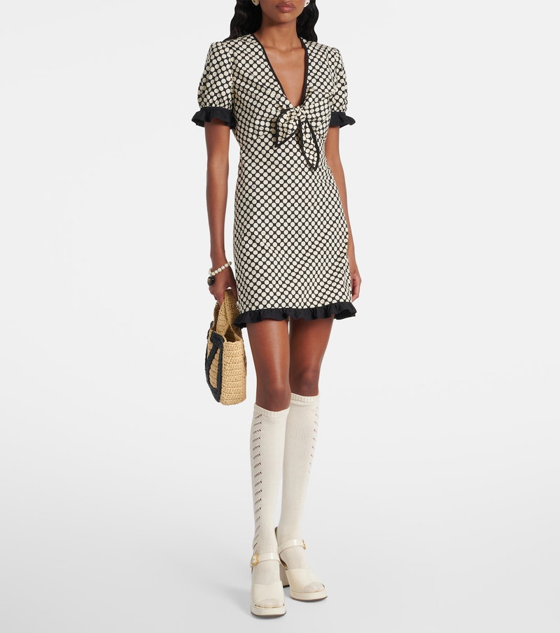 Valentino black and white houndstooth dress with ruffled sleeves and striped socks