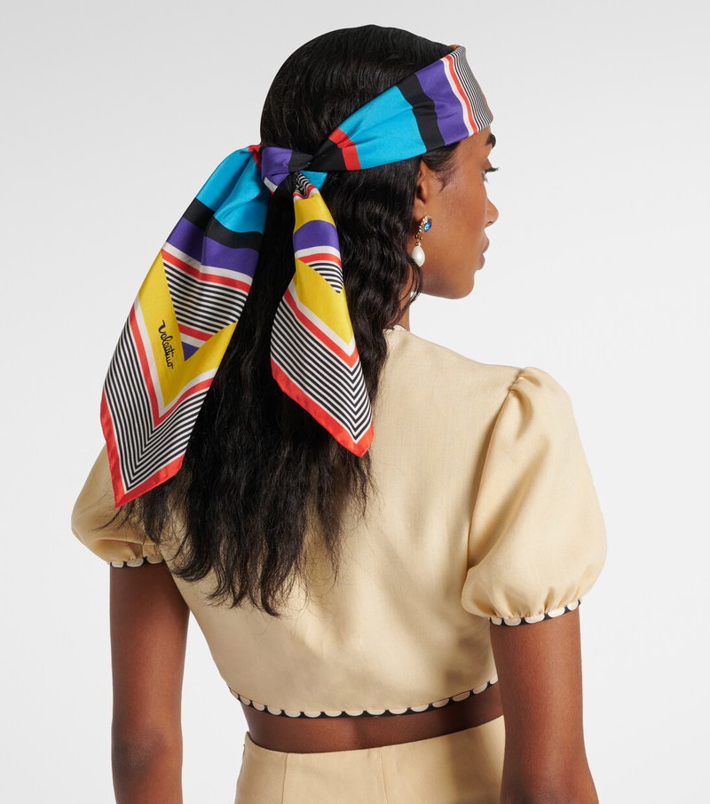 Valentino scarf-adorned woman with pearl earrings